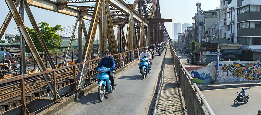 Long Bien Bridge in Hanoi, Vietnam, with heavy motorcycle traffic