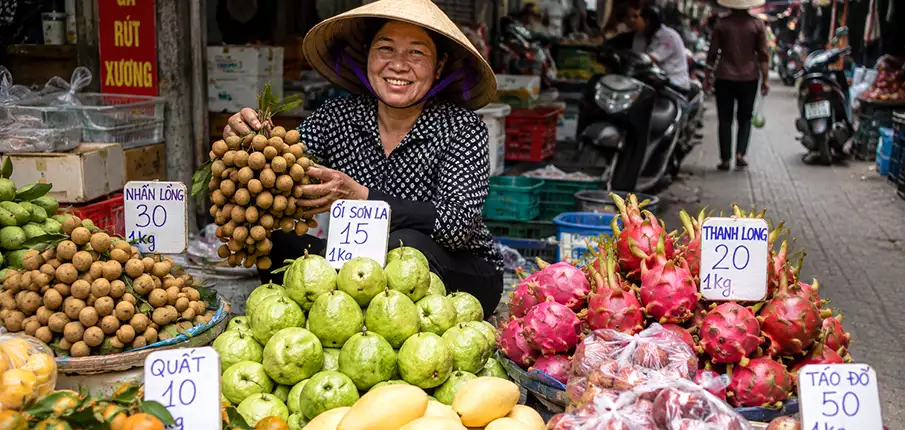 Exotic fruits and fresh vegetables at a market in Vietnam