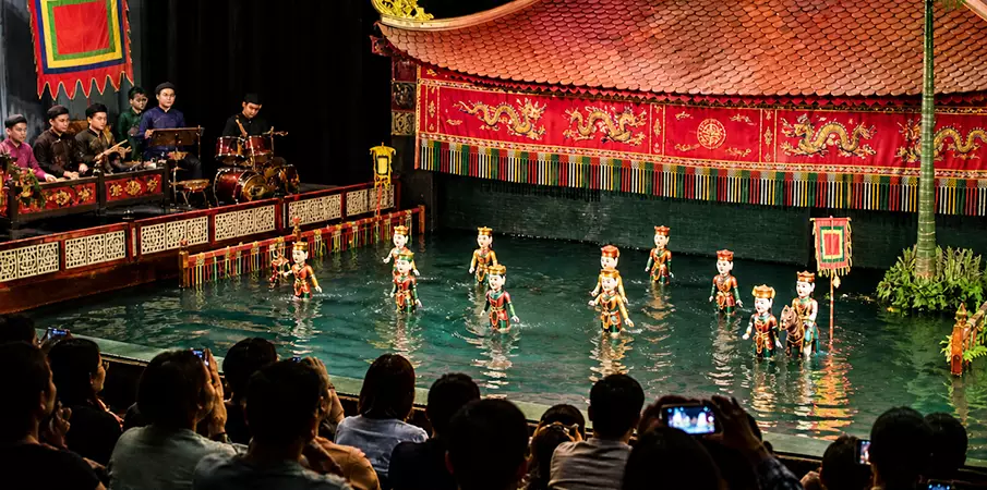 Water puppet theatre in Hanoi with traditional puppets on the water surface and a cultural performance