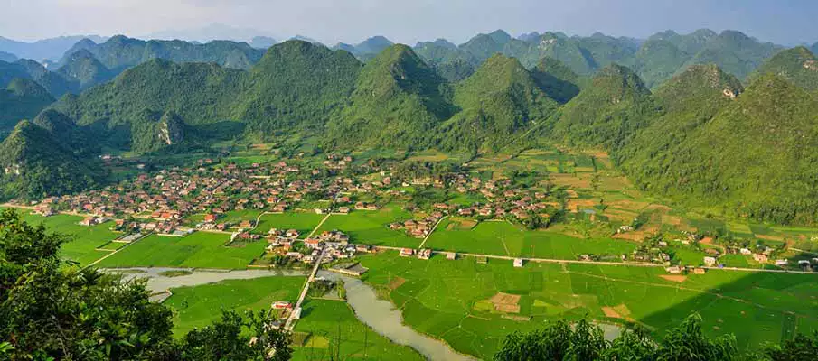 Panoramic view of Bac Son Valley surrounded by limestone mountains in Lang Son Province, Vietnam