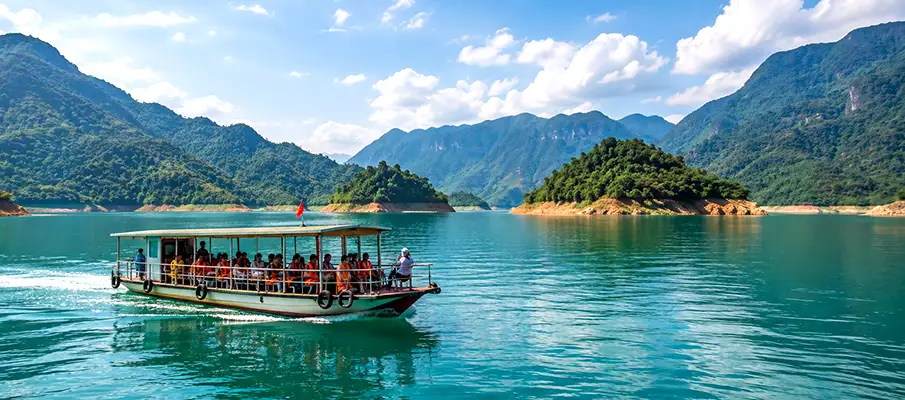 Tourist boat on Hoa Binh Lake near Mai Chau