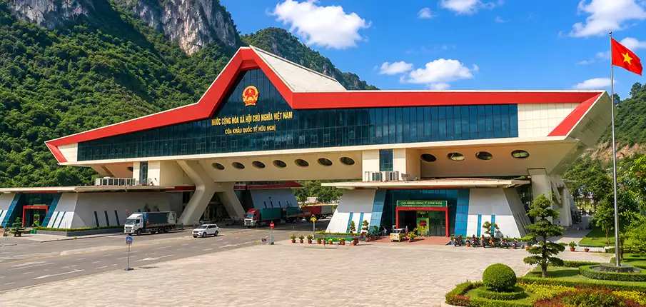 Modern Huu Nghi International Border Gate surrounded by limestone mountains in Lang Son Province, Vietnam