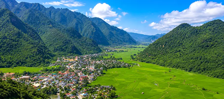 Panoramic view of Mai Chau Valley and green rice fields from the Mai Chau Flagpole viewpoint in Northern Vietnam