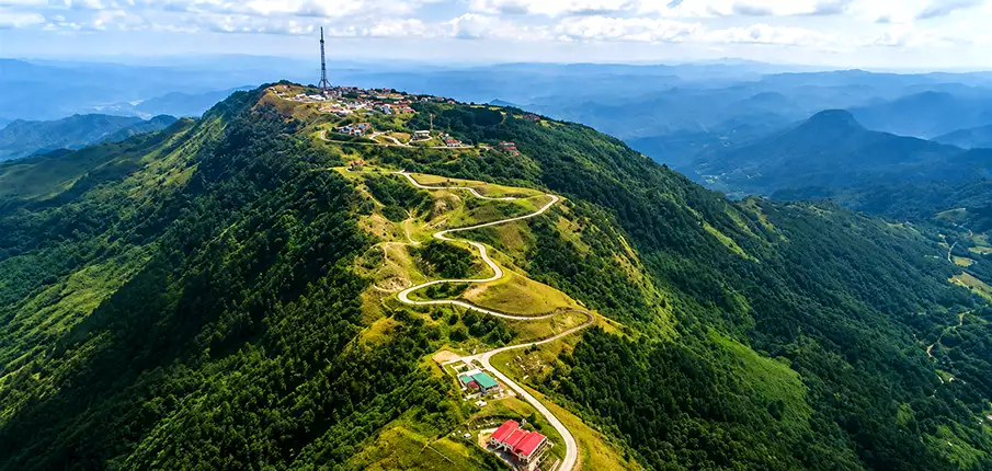 Scenic mountain road leading to Mau Son Mountain Resort in Lang Son, Vietnam