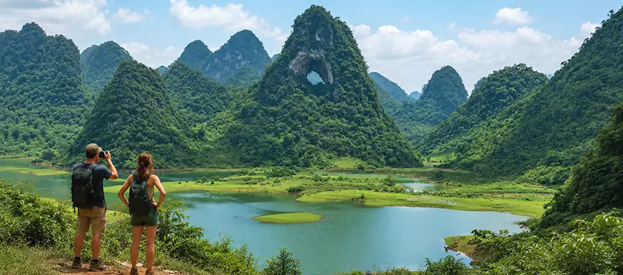 Panoramic view of Phja Piót (God's Eye Mountain) surrounded by lakes and limestone mountains in Cao Bang Province