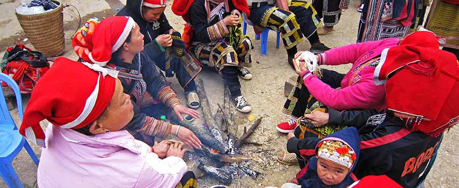 Red Dao women wearing traditional clothing in Ta Phin Village near Sapa in Northern Vietnam