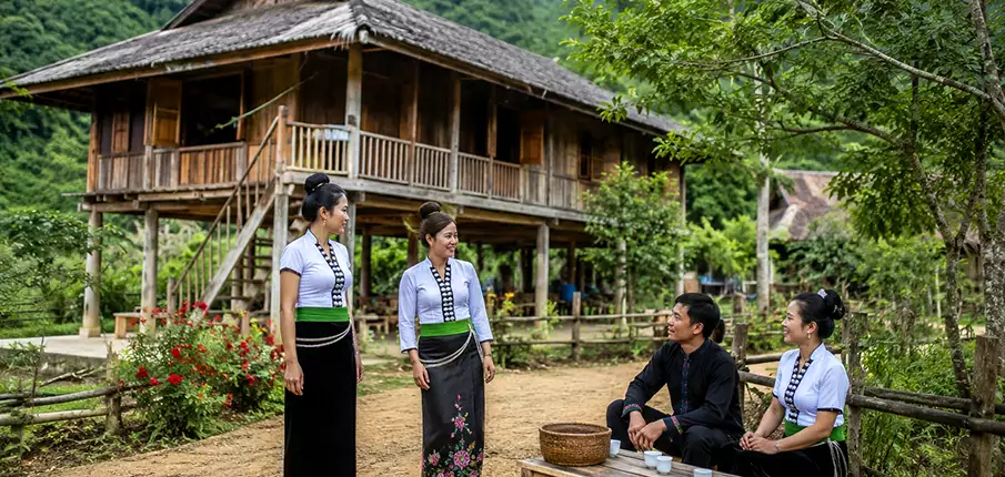 Traditional Thai Stilt House in Dien Bien, Vietnam Thai ethnic minority people outside a traditional stilt house in Dien Bien, Vietnam