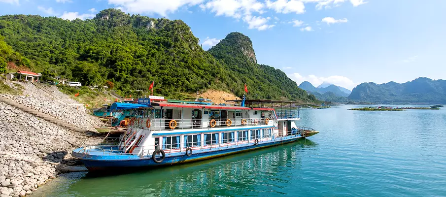 Tour Boats at Thung Nai Port on Hoa Binh Lake Colorful tour boats at Thung Nai Port on Hoa Binh Lake in northern Vietnam