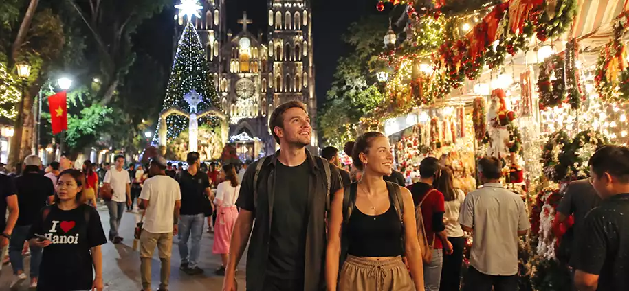 Tourists Experiencing Christmas in Hanoi, Vietnam Tourists experiencing Christmas in Hanoi Vietnam