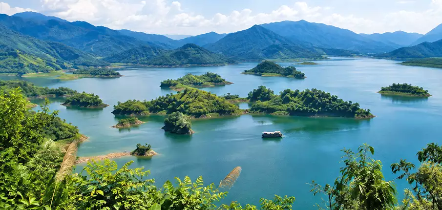 Panoramic View of Hoa Binh Lake in Northern Vietnam Panoramic viewpoint over Hoa Binh Lake surrounded by forested islands and mountains in northern Vietnam