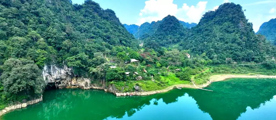 Thang Hen Lake viewed from the opposite side with limestone mountains in Cao Bang Vietnam