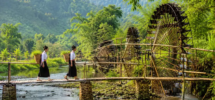Pu Luong Giant Waterwheels in Thanh Hoa, Vietnam Traditional giant bamboo waterwheels along a stream in Pu Luong Nature Reserve, Thanh Hoa, Vietnam