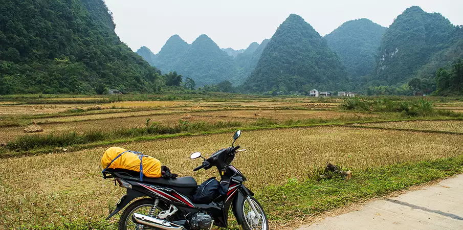 Motorbike riding on scenic roads around Ban Gioc Waterfall in Cao Bang, Vietnam